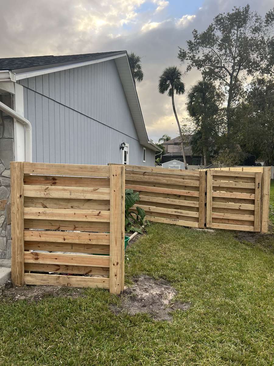 Horizontal wood privacy fence with gate