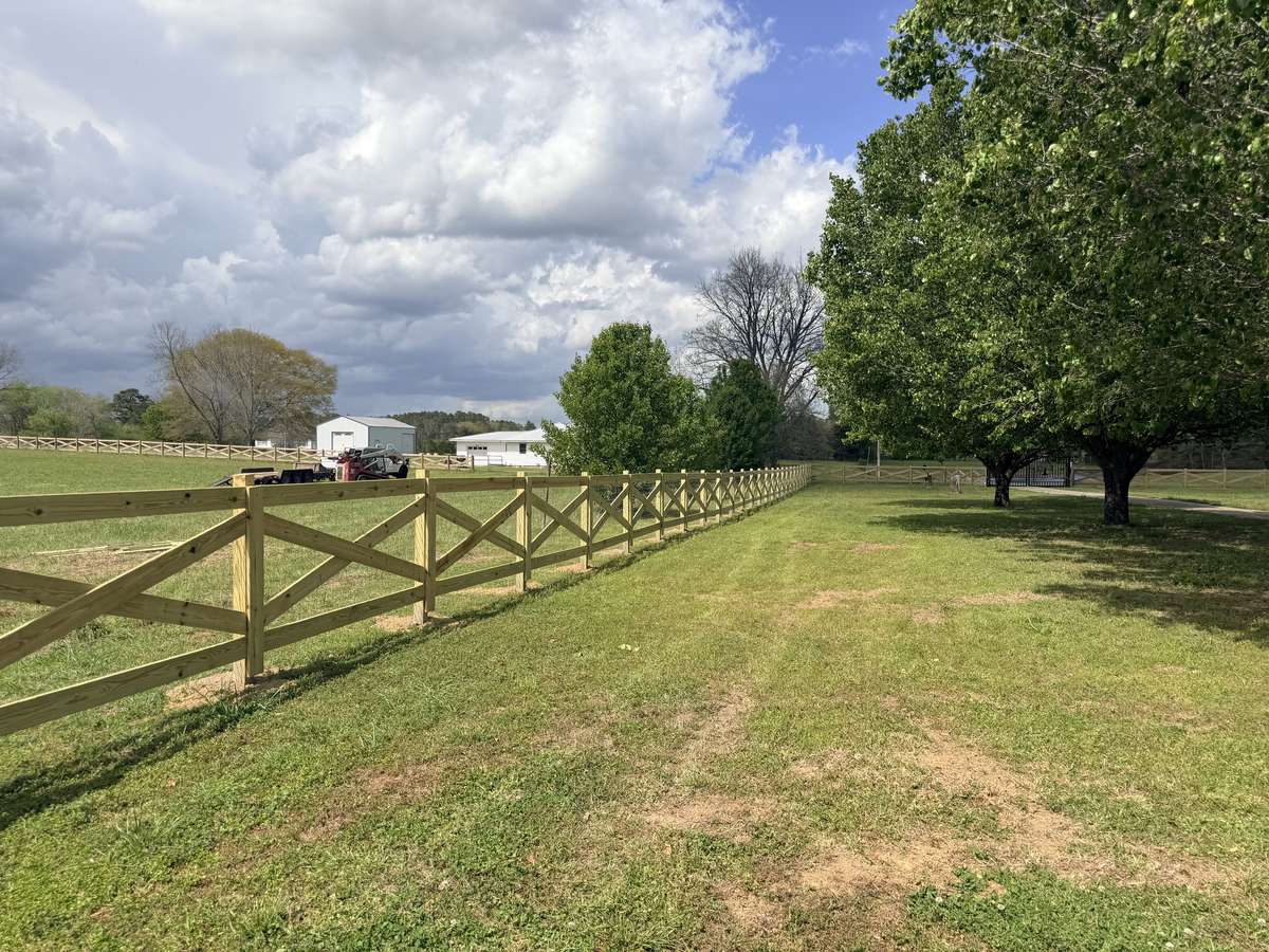 Cross brace board fence on farm
